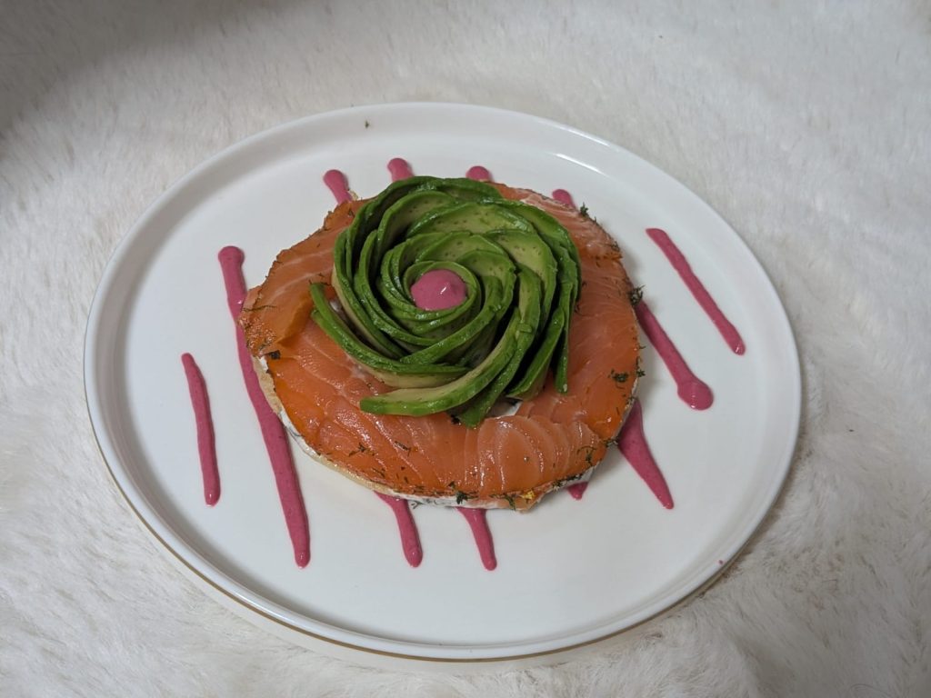 Cured salmon starter with an avocado rose, bespoke plating adapted to dietary requirements